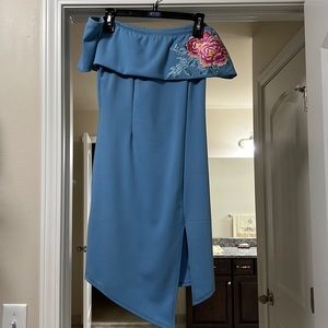 Light blue off shoulder dress.